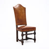 Four Louis XIII Style Leather Dining Chairs