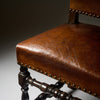 Four Louis XIII Style Leather Dining Chairs